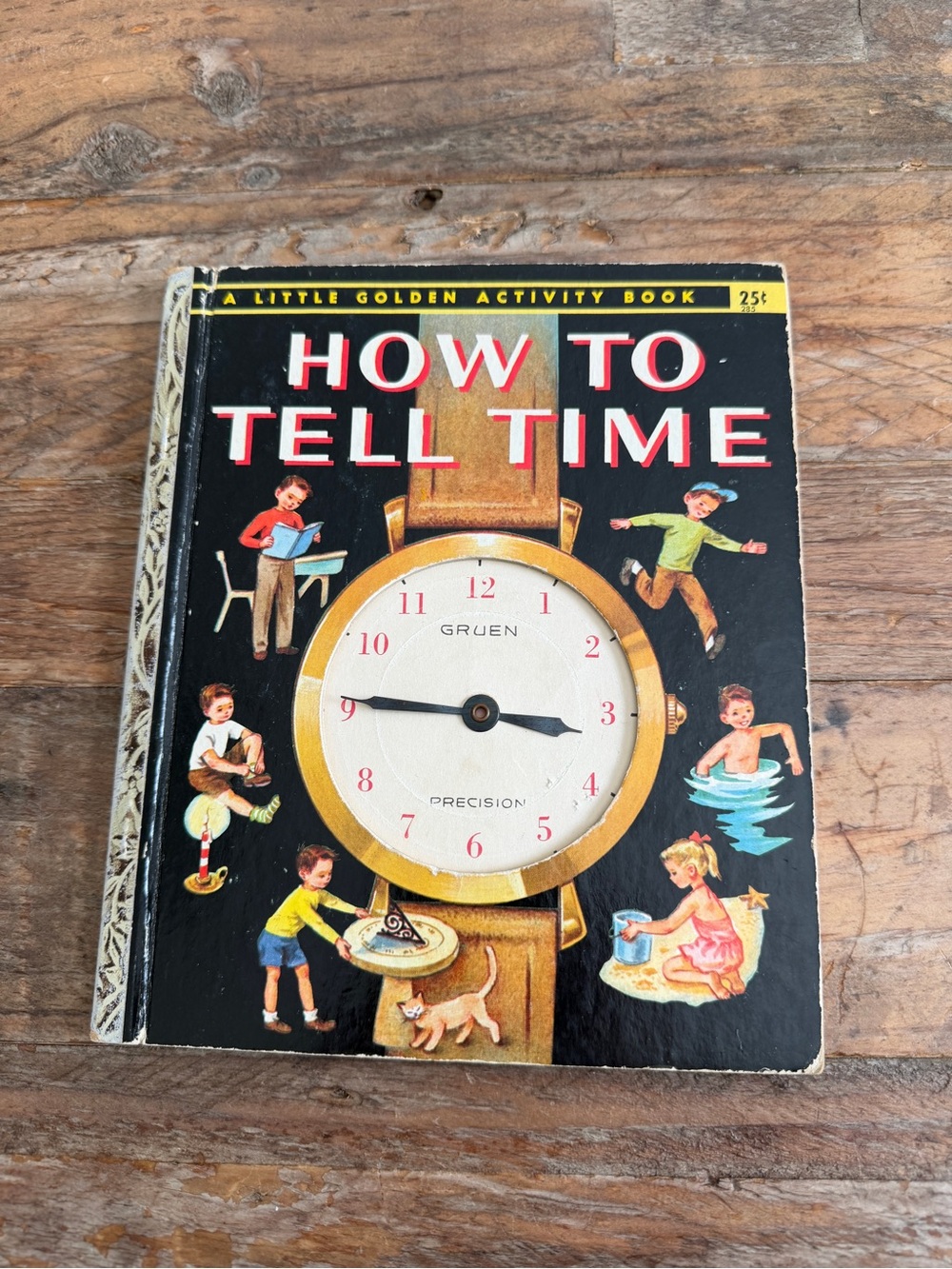 Gruen How to Tell Time Kids Book - Black and Gold Cover